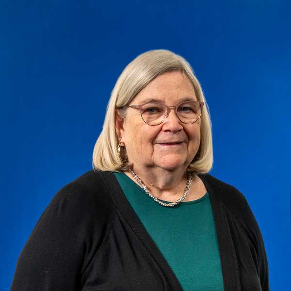 a white woman with glasses