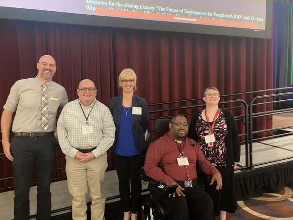 Group of presenters posing for a photo